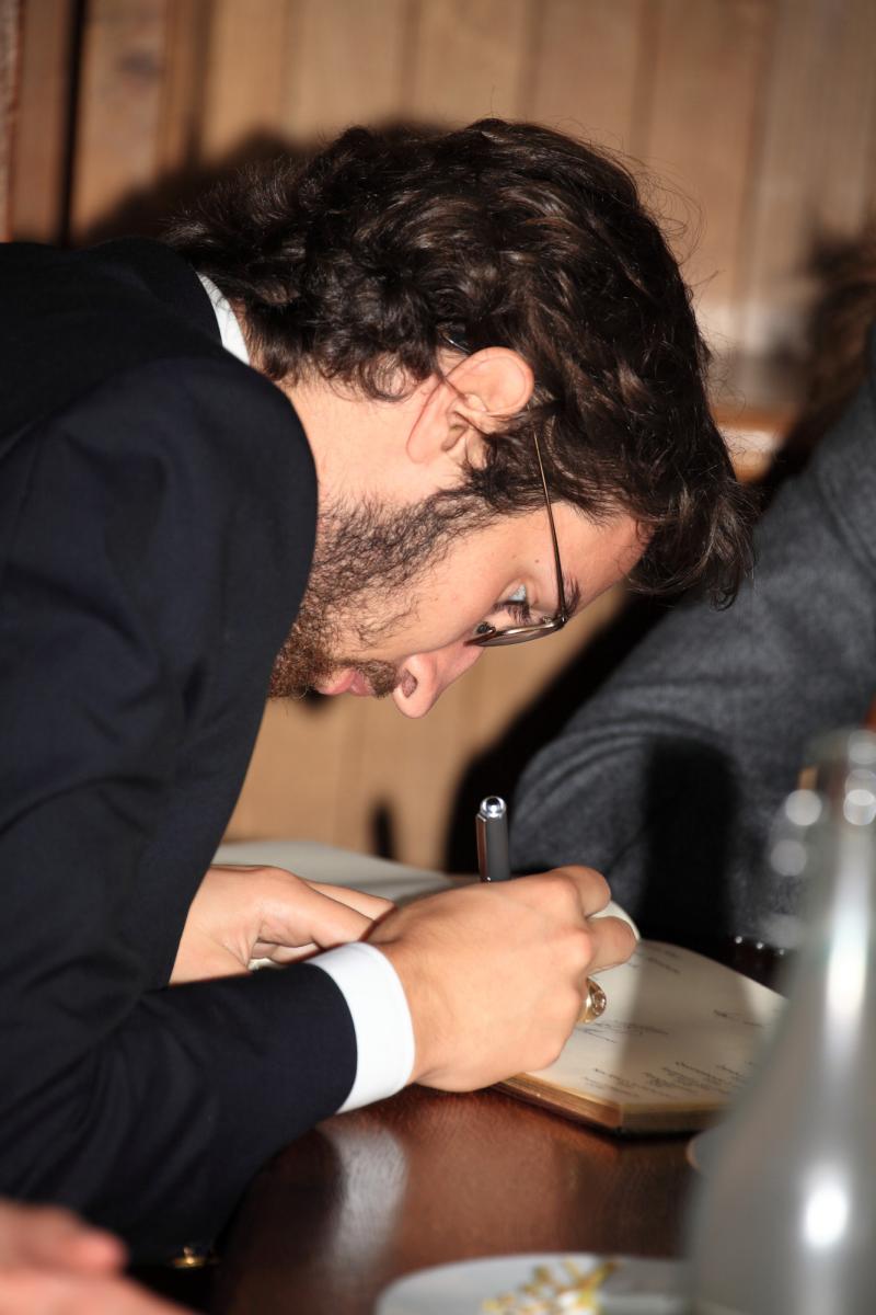 Rhodes Scholar Evan Behrle signing the register at Oxford University 